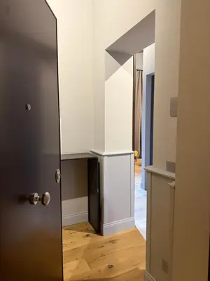 a door with a mirror in a room at Spiriti Home Apartment , New Opening Piazza di Pietra in Rome