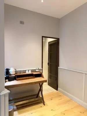 a room with a wooden table and a mirror at Spiriti Home Apartment 3, New Opening Piazza di Pietra in Rome