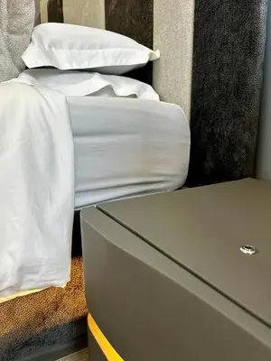 a switch on a wall next to a bed at B&B GarbaCity-Inn in Rome