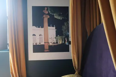 a picture of a statue in a painting in a bedroom at Testaccio Room in Rome in Rome