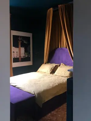 a bedroom with a bed with a canopy at Testaccio Room in Rome in Rome