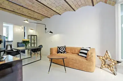a living room with a couch and a table at YCH-Laterano Charme in Rome