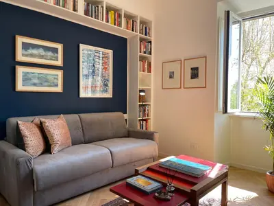 a living room with a couch and a table at Terme di Tito Colosseum in Rome