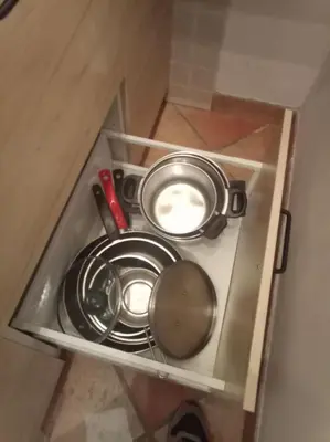 a cabinet with two pans and a pot on it at My Cocoon in Rome