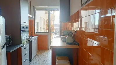 a kitchen with a counter with a tea kettle on it at A casa di Ugo - Colors and space at Pigneto, Rome in Rome