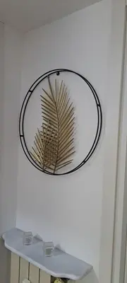 a mirror hanging on a wall with a shelf at Bart Rome House in Rome