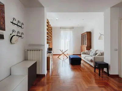 a living room with a couch and a table at Vittorio Panoramic Apartment in Rome
