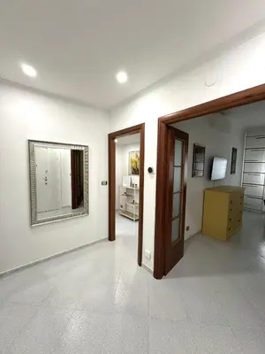 an empty room with a door and a mirror at Residenza Tulipano in Rome