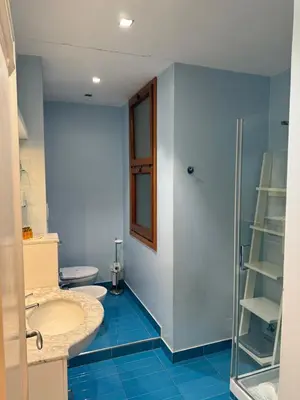 a bathroom with a toilet and a sink and a shower at St Peter Rooms with Private Parking by Dama in Rome