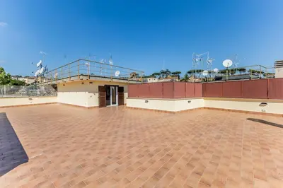 a large building with a balcony on top of it at APT ROME Sergio I - San Pietro Vatican in Rome