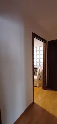 an empty room with a white wall and a doorway at Lively House in Rome