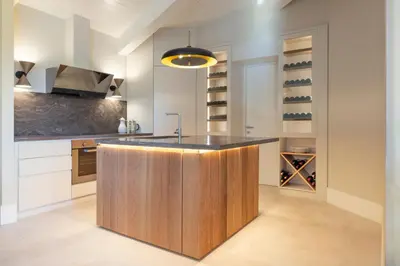 a kitchen with a wooden island in the middle at Dimora della Luna in Rome