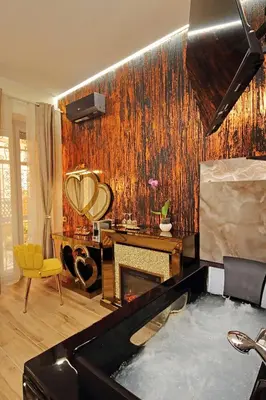 a bathroom with a bath tub and a fireplace at Just Chilling Ferruccio in Rome