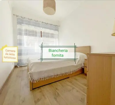 a bedroom with a bed with a sign on it at Vacanze romane in Rome