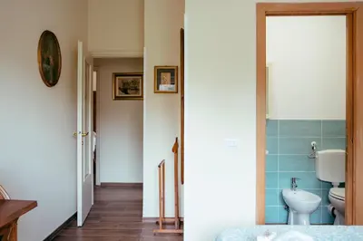 a bathroom with a toilet and a sink at Eleganza e Arte a Città Giardino 5' Metro B in Rome