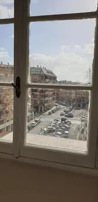 a window with a view of a parking lot at Camera con vista MetroA in Rome