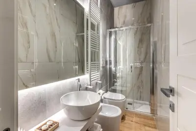 a bathroom with a sink and a toilet and a shower at Maison Carrozze in Rome