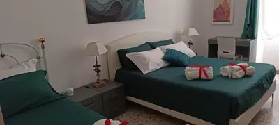 a bedroom with two beds with presents on them at MURA DI PRATI - Spazioso appartamento per 8 a San Pietro in Rome