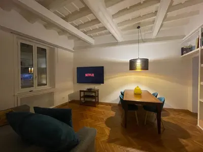 a living room with a table and a tv at carpe diem sistina in Rome