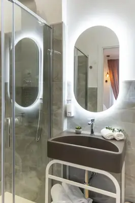 a bathroom with a sink and a mirror at cinquepuntozero in Rome