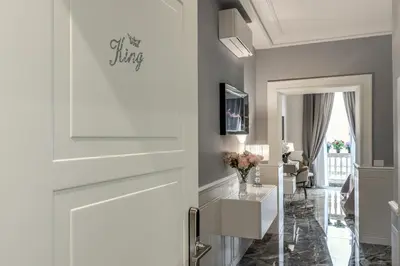 a door leading into a living room with a table at Spanish Steps Oasis Suite in Rome