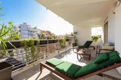 an apartment balcony with a view of a city at Boutique Domus Trastevere Family in Rome