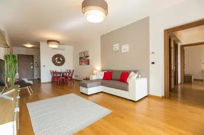 a living room with a couch and a table at Boutique Domus Trastevere Family in Rome