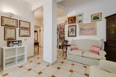a living room with a couch and a table at Casa Marino Roma in Rome