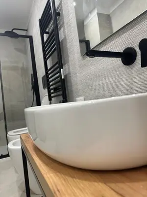 a bathroom with a white sink and a toilet at Star Suite Rome in Rome