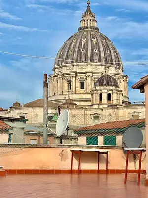 a view of a domed building from a rooftop at Domus San Pietro - Elegant stay in Vatican in Rome