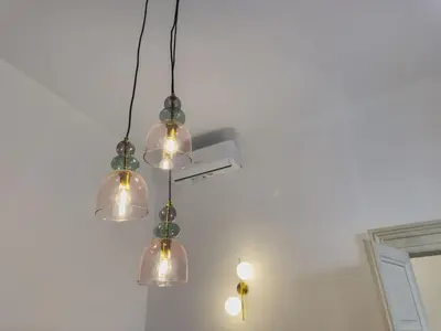 a cluster of lights hanging from a ceiling at Barberini Grand Retreat with Terrace in Rome