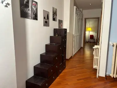 a room with a staircase with four drawers at Cris House Monteverde in Rome