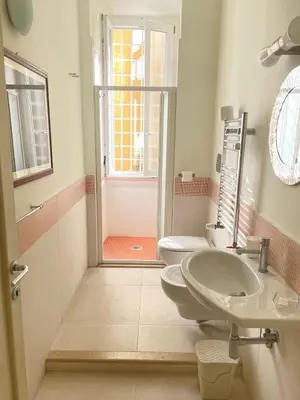 a bathroom with a sink and a toilet at Celio west side apartment in Rome