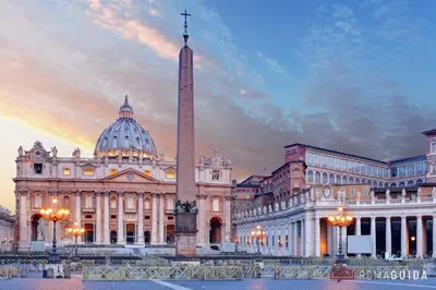 a large building with a tall obelisk in front of a tower at La Casa Di Rinny - Vaticano in Rome