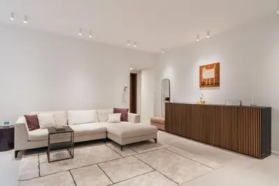 a living room with a couch and a table at GuestHost - Pannonia Colosseum in Rome