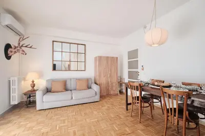a living room with a couch and a table at Basilica San Paolo - Luxurious penthouse with Wi-Fi in Rome