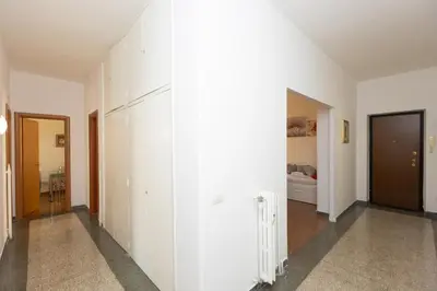 an empty hallway with white walls and a room at Jenner Apartment by Rental in Rome in Rome