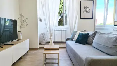 a living room with a couch and a tv at LoveRhome Apartment 14 in Rome