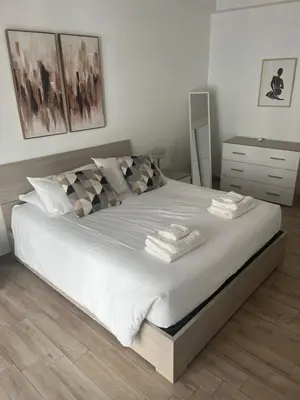 a bedroom with a large bed with towels on it at LoveRhome Apartment 14 in Rome