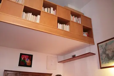 a room with wooden shelves on the wall at Baccina cozy apartment in Rome