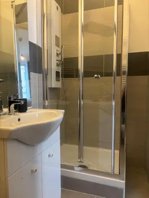 a bathroom with a shower and a sink at PORTA FURBA Suites in Rome