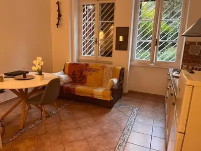 a living room with a couch and a table at Holiday home Roma Night and Day in Rome