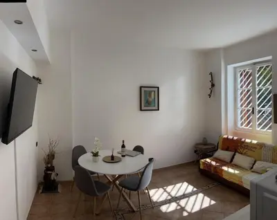 a living room with a table and a couch at Holiday home Roma Night and Day in Rome