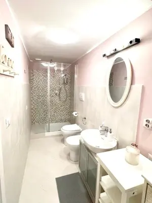a bathroom with a toilet and a sink and a shower at Vacanze Romane a San Giovanni in Rome