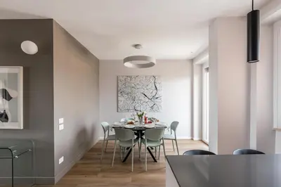 a dining room with a table and chairs at The Best Rent - Spacious three-bedroom flat in the San Giovanni area in Rome