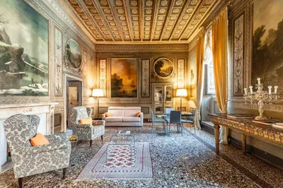a living room with a couch and a table at Palazzo Borghese, a Burghesius home in Rome