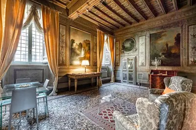a living room with a couch and a table at Palazzo Borghese, a Burghesius home in Rome