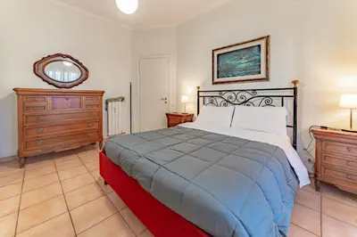 a bedroom with a bed and a dresser and a mirror at Marta Suite - Metro Malatesta & Wi-Fi in Rome