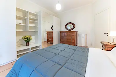a bedroom with a large bed and a dresser at Marta Suite - Metro Malatesta & Wi-Fi in Rome