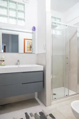 a bathroom with a sink and a shower at Lion Renting Marconi in Rome